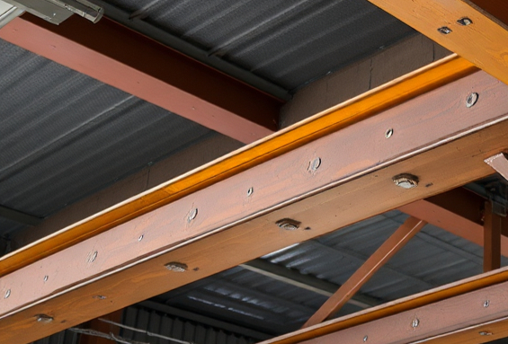 Reclaimed rolled steel joists stacked ready for reuse