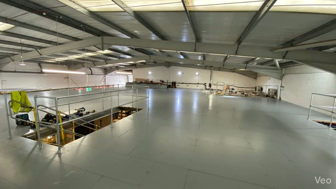 A completed mezzanine deck running the length of a warehouse unit